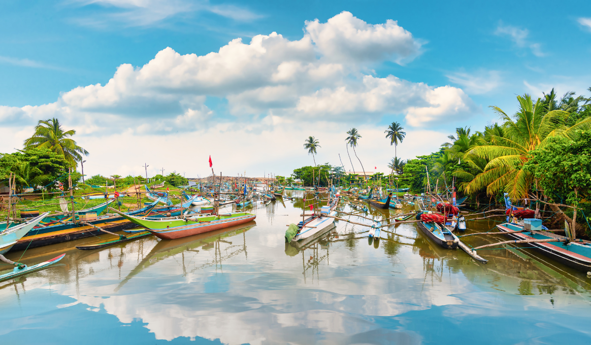 Temple of the Tooth Relic in Kandy, Sri Lanka with visitors.