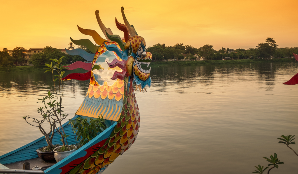 Ha Long Bay Vietnam with limestone cliffs, blue sea, and cruise boats